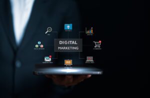Businessman holding tablet with online digital marketing technology icons. Increasing market share and profit by SEO, Advertising, E-commerce. Online marketing strategy, direct and sale network.